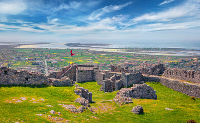Bright summer view of ruins of Lezhe Fortress with no tourists. Amazing morning cityscape of Lezha...