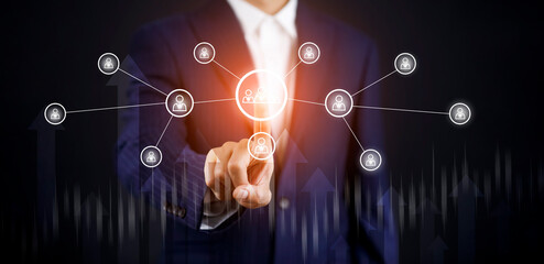 Businessman holding HR Human, people icon on the graph Screen of a media screen, Technology Process System Business with Recruitment, Hiring, Team Building. Organization structure concept.