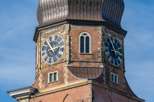 View of the tower clock of the main church St. Katharinen in the Speicherstadt of Hamburg, Germany. The church was opened in 1659.
