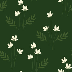 Seamless vector pattern with hand-drawn wild flowers on green background, spring field.