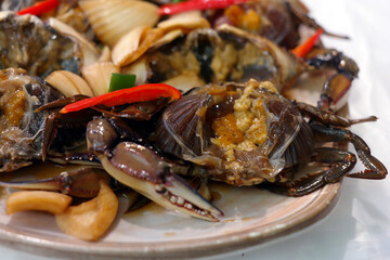 Soy Sauce Marinated Crab with a lid removed to make it easy to eat.