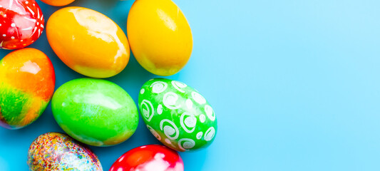 closeup, many beautiful painted Easter eggs as blue background. the concept for good friday, easter...