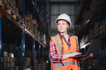 Logistic distribution center or Inventory hub warehouse concept, Female worker working stock check...