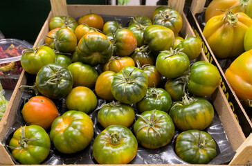 Fresh vegetables and fruits at an indoor produce market, Rome, Italy