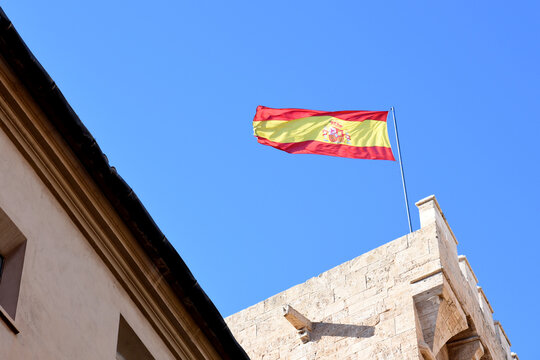 Spain flags on blue sky background. Catalonia Barcelona flag with spain and europe flag. Flag of Valencian Community is an autonomous community of Spain.