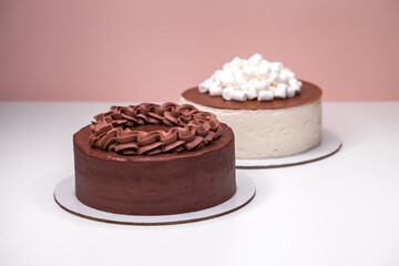 Homemade chocolate cake topped with whipped ganache