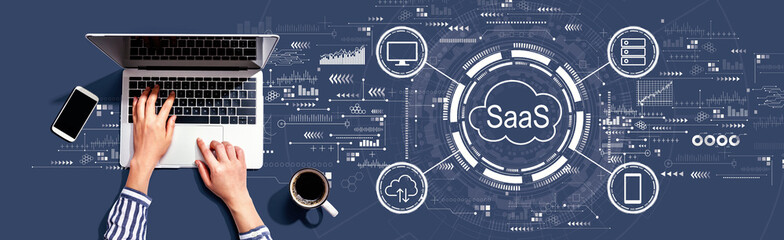 SaaS - software as a service concept with person using a laptop computer