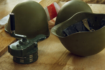 Military ammunition. Military helmets and hand siren. manual siren alarm