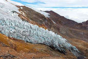 Cayambe volcano panoramic view over receding glacier due to climate change in Andes mountains,...
