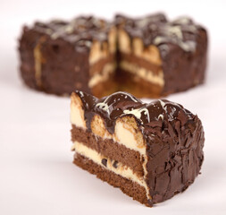 Closeup picture of profiteroles bathing in chocolate