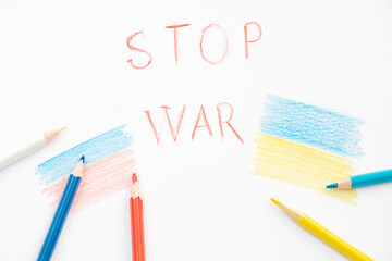 Sketch drawing colourful pencils and red word "stop war" on white background. No war concept