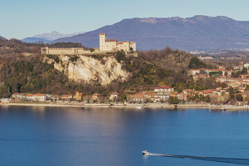 High angle view of Borromeo Castle and Lake Maggiore. The castle lies on a lakeside hilltop in the...