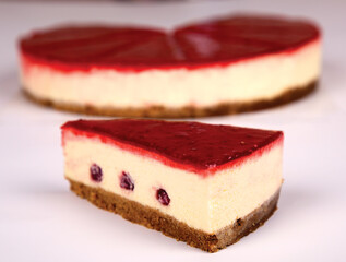 Slice of raspberry cheesecake on a white background. Cheesecake in New York. advertisement. Restaurant menu.