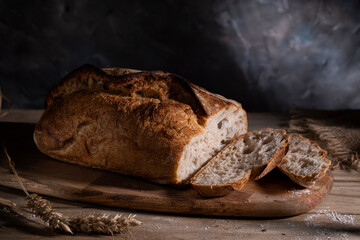 White wheat sliced ​​bread on a wooden table