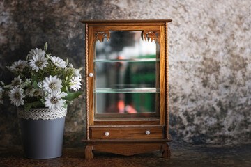 Antique wooden cabinet with mirror and drawers
