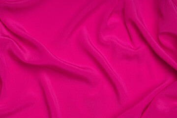 Smooth elegant pink silk or satin texture can use as abstract background. Luxurious background design