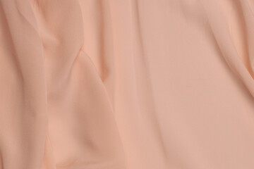 Silk background, peach fabric background.