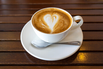  Latte coffee or cappuccino coffee in white cup on wooden table