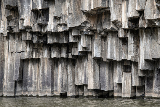 Vew of the hexagonal basalt columns in the  Hexagon [Meshushim] Pool, a natural pool by Meshushim Stream in Yehudia Forest Nature Reserve, in central Golan Heights, Israel