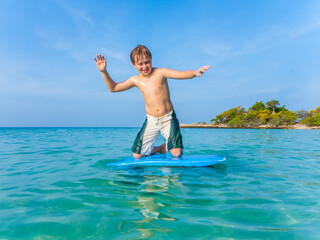 boy surfing in the sea