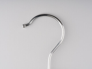 A hook from a clothes hanger. Closeup. Space for text