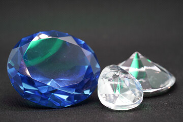 Brilliant cut green diamonds photographed in the studio with a colored background