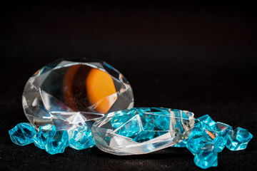 Brilliant cut green diamonds photographed in the studio with a colored background