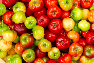 Pile of Acerola Cherry or Barbados Cherry background, top view.