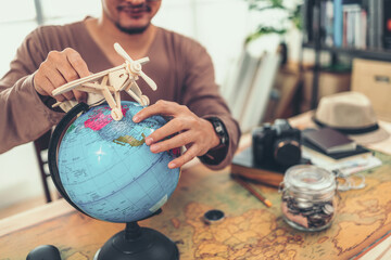 Hands playing model air plane to fly near Globe sphere orb model vintage. Travel , Adventure and Discovery concept.