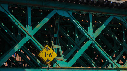 Close up from iron bridge construction with traffic sign