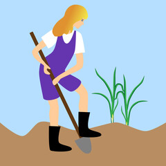 Woman digging a bed in the garden plot.