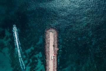 Beach and waves from top view. Turquoise water background from top view. Summer seascape from air....