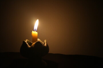 burning candle in the dark