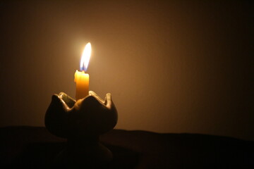 burning candle in the dark