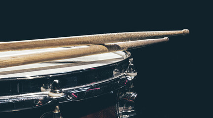 Close-up, snare drum on a dark background isolated, copy space. - obrazy, fototapety, plakaty