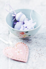 Simple Easter Decoration. Bright stone background. Soft focus. Close up.