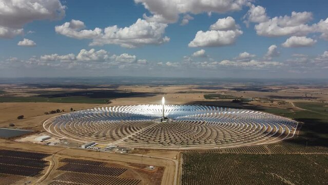 Aerial drone view of Gemasolar Thermosolar Plant in Seville, Spain. Solar energy. Green energy. Alternatives to fossil fuel. Environmentally friendly. Concentrated solar power plant. Renewable energy.
