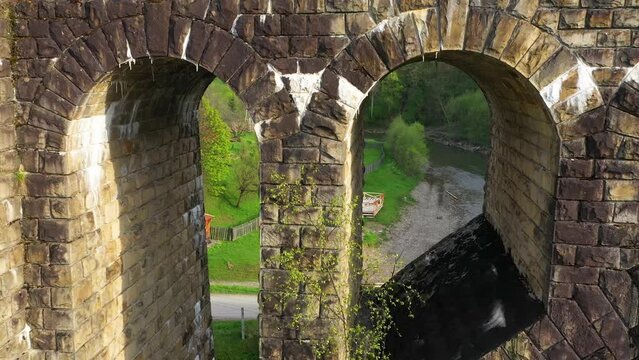 stone arched railway bridge over the Prut River in the Carpathians in the village of Vorokhta. One of the oldest and longest stone arched bridges (viaducts) in Europe: length 200 meters;