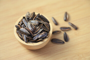 Fresh organic sunflower seed on sackin bowl  in kitchen for cooking in daily life meal. selective focus.