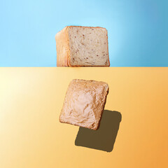 Creative breakfast concept.Falling peanut butter sandwich with copy space.