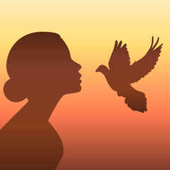 Women's silhouette on sunset background. Flying pigeon, symbol of peace in world.