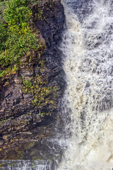 Fototapeta na wymiar Getting very near the side falls and its flow - Kakabeka Falls, Thunder Bay, ON, Canada