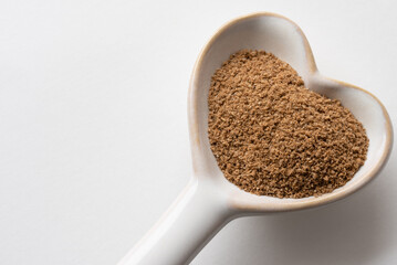 Ground Cumin on a Heart Shaped Spoon