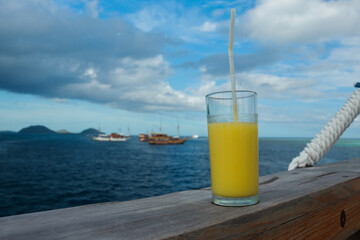 glass of juice on the sea