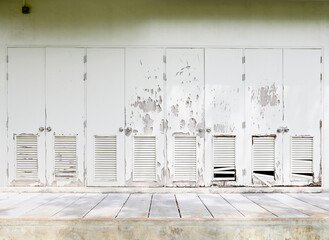 cracked peeling paint on wood doors of the old cabinet 