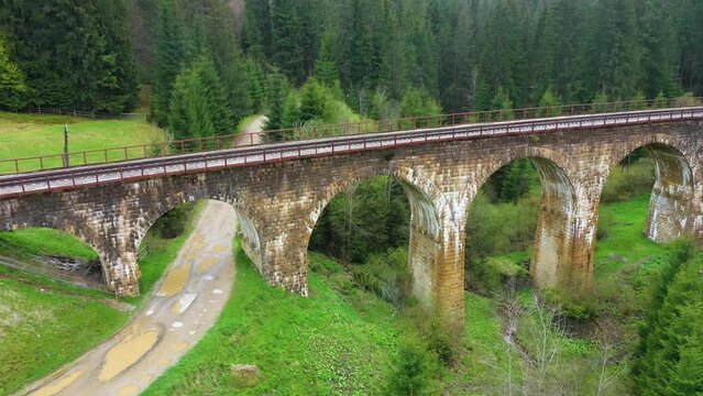 stone arched railway bridge over the Prut River in the Carpathians in the village of Vorokhta. One of the oldest and longest stone arched bridges (viaducts) in Europe: length 200 meters;