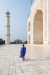 Woman wearing a blue sari in Taj Mahal, Agra, India