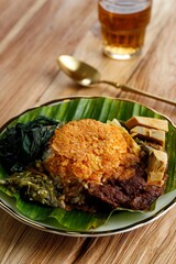 Nasi Padang Served with Rendang, Young Jackfruit Curry,  Cassava Leaves, and Sambal Hijau