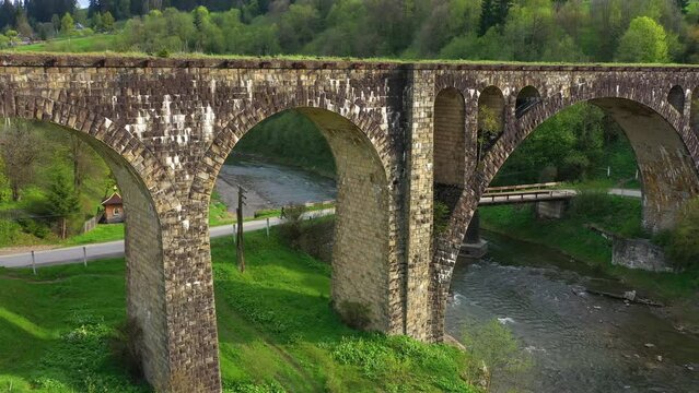 stone arched railway bridge over the Prut River in the Carpathians in the village of Vorokhta. One of the oldest and longest stone arched bridges (viaducts) in Europe: length 200 meters;