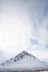 Buachaille Etive Mor covered in snow during winter aerial view